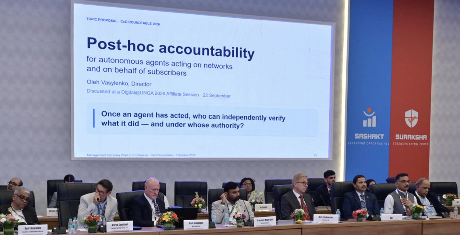 Title slide of the presentation on the screen in the Roundtable room